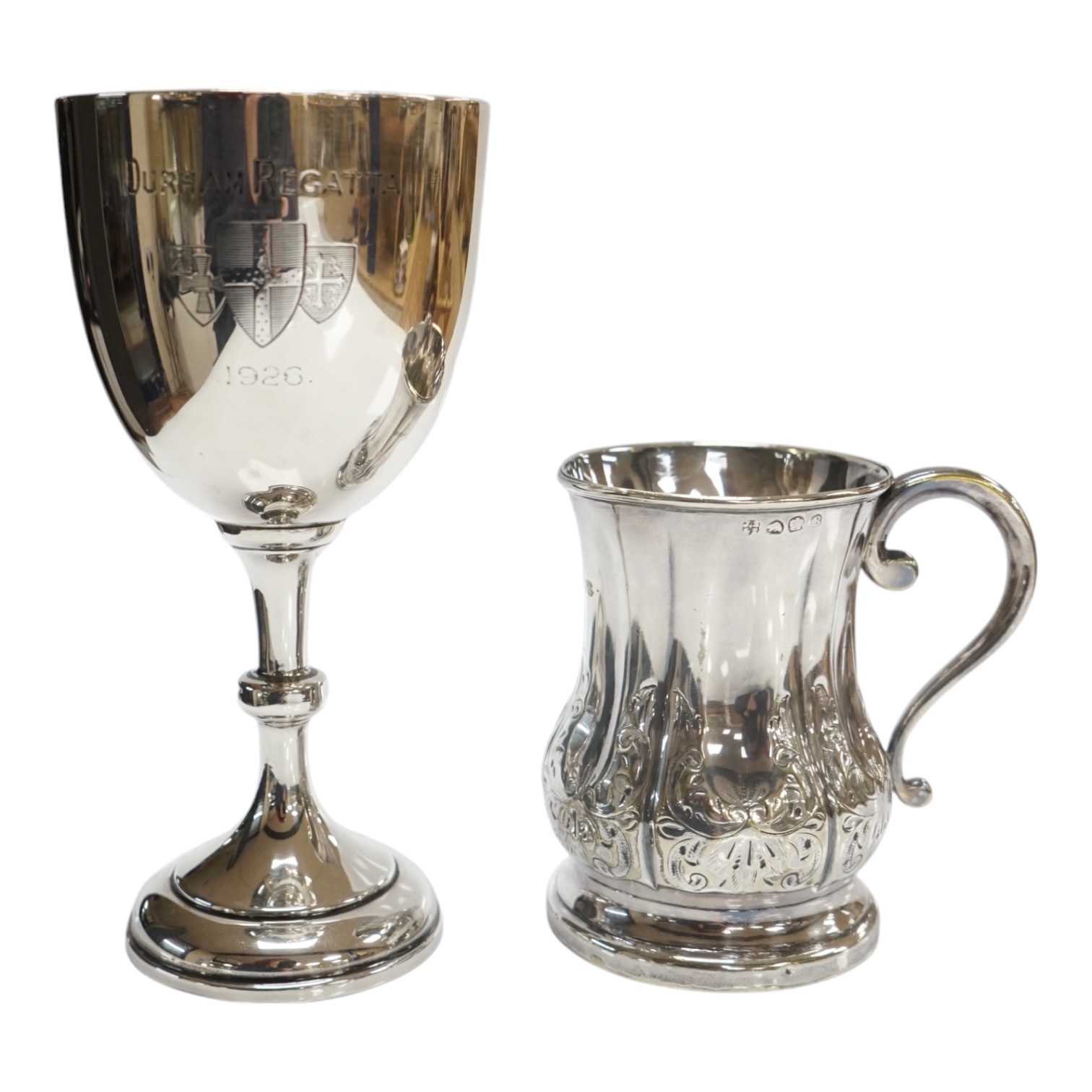 A George V silver goblet, Harrison & Sons, Birmingham, 1925, 15.3cm and a silver plated christening mug. Condition - fair